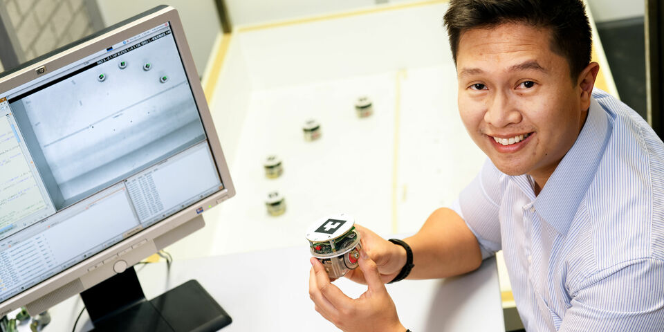 Anggera Bayuwindra with the E-pucks. Photo | Bart van Overbeeke